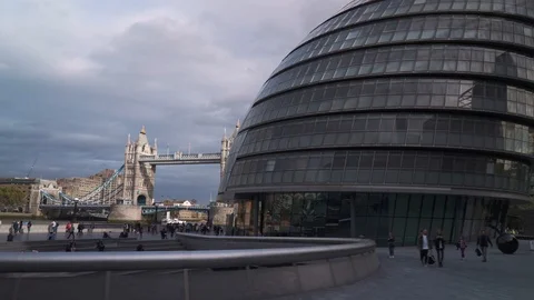 Moving shot view of Tower Bridge and London City Hall in autumn during day time Stock Footage 121618381