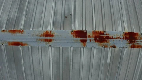 Moving sidewards over a resty tin roof, showing the roof in detail Stock Footage 160318864