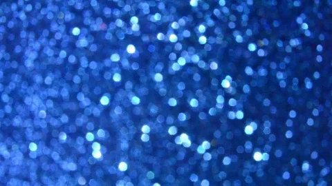 Moving slow glitter defocused bokeh lights background, trendy classic blue Stock Footage 124988508