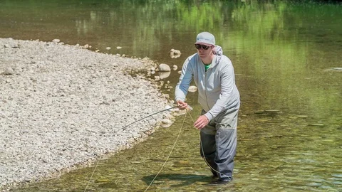 Moving slowly backwards and pulling a fish hook Stock Footage 105229680