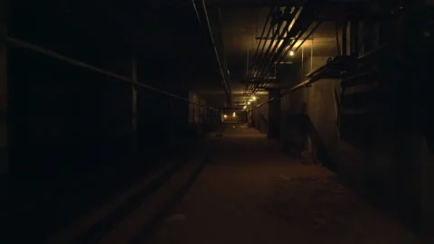 Moving slowly through a dark dimly lit basement Stock Footage 132354606