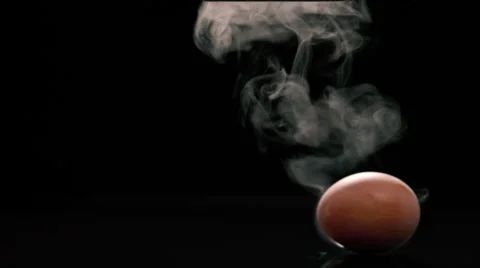 Moving spinning boiled egg black background Stock Footage 58500218
