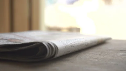 Moving the stack of newspapers Stock Footage 130167206