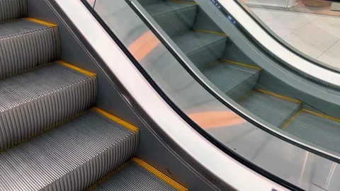Moving staircases running up and down. Escalator stairs in the shopping mall Video stock 219246378