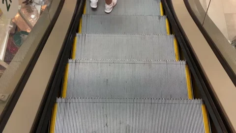 Moving stairs escalator moving down to shop floor Video stock 139756452
