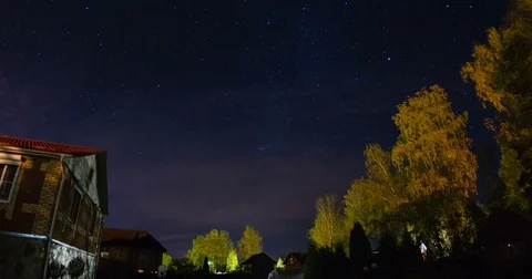 Moving stars over timber house at autumn night Stock Footage 81214596