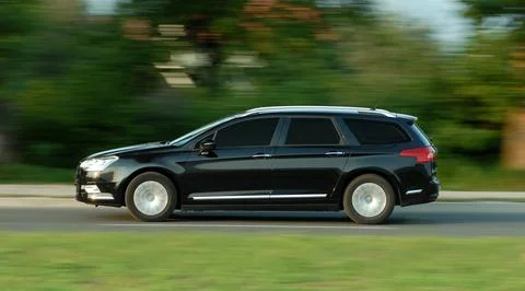 Moving station wagon Stock Photos