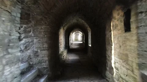 Moving in stone tunnel in medieval castle Stock Footage 156487367