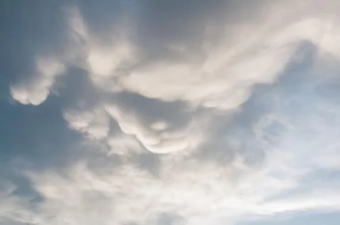 Moving Storm Cloud under the Sunlight shining Stock Photos