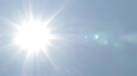 Moving sun in the clear blue sky Stock Footage 54272993