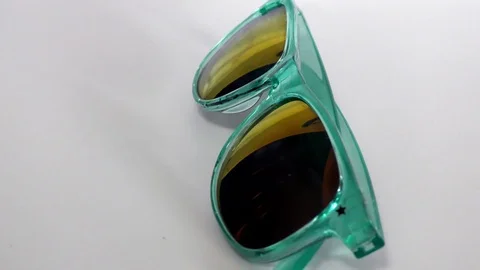 The moving sunglasses on the white surface Stock Footage 111887505