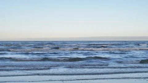 Moving surface of a cold baltic sea and a clear sky. Video stock 121859376
