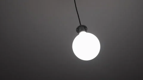 Moving suspended light bulb right to left. Stock Footage 322122869