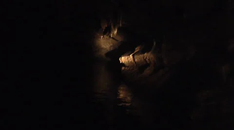 Moving through a Cave on a Boat with a Flashlight Stock-Footage 51913875