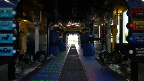 Moving through conveyorized automated car wash Stock Footage 155762995
