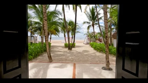 Moving through doors that lead to a beach paradise Video stock 272651217