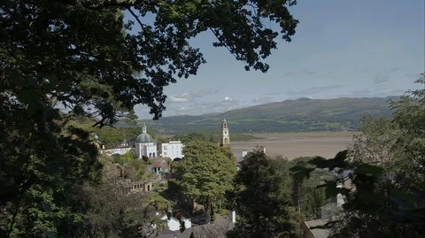 Moving through the hilltop trees overlooking a mythical town Stock Footage 128550512