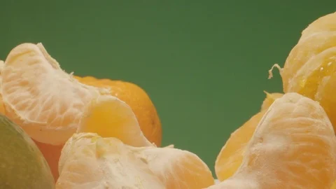 Moving Through Mandarin Oranges in Extreme Close Macro Shot with Green Screen Stock Footage 126771575