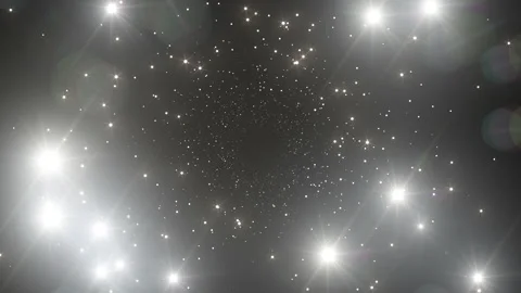 Moving Through the Photo Flashes Seamless. Bright Twinkling Flares on Black Stock Footage 135234096