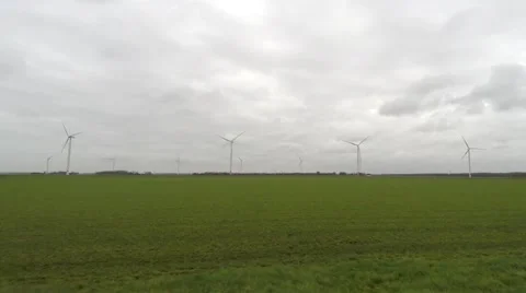Moving through polder landscape wind turbines in background 4k Stock Footage 60582889