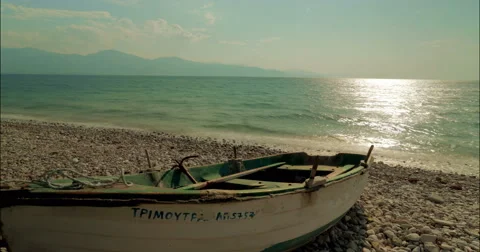 Moving time lapse with a boat and the sun rising over the sea 4K Stock Footage 49153024