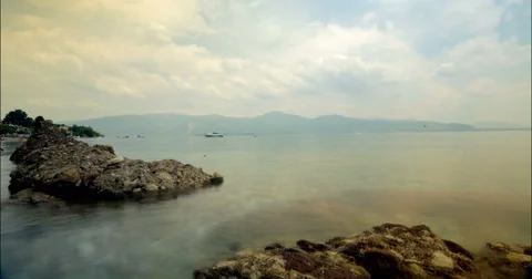 Moving time lapse with clouds close to sea and waves 4K Stock Footage 49152355