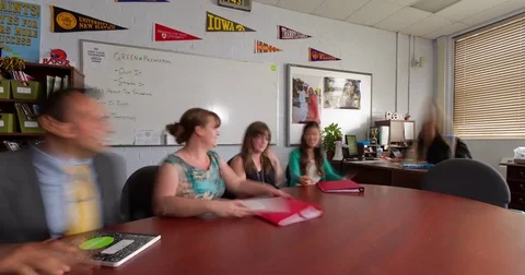 Moving Time-Lapse of teacher meeting in a classroom Stock Footage 70974553
