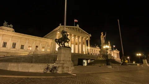 Moving timelapse / Hyperlapse of Austrian Parliament in Vienna at night Stock Footage 105639015