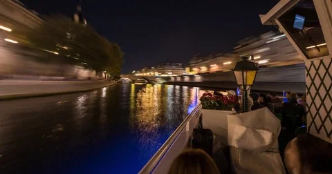 Moving timelapse / hyperlapse from a boat moving down river Seine at night Stock Footage 84683101
