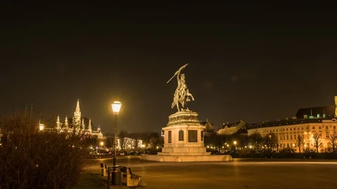 Moving timelapse / hyperlapse of Erzhercog Karl statue at night with Rathaus  Stock Footage 105639445