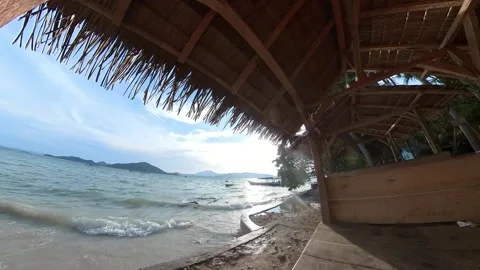 Moving Timelapse of sea, beach, waves, splashes taken from gazebos Stock Footage 269486888