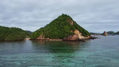 MOVING TOWARDS HILL NEXT TO BEACH 動画素材 221303849