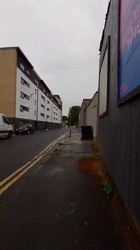 Moving towards a large black dumpster - Vertical Video Video stock 200400568