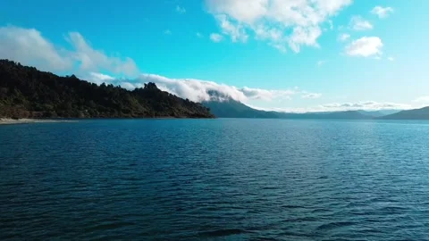 MOVING TOWARDS MOUNTAIN ON LAKE Stock Footage 251504794