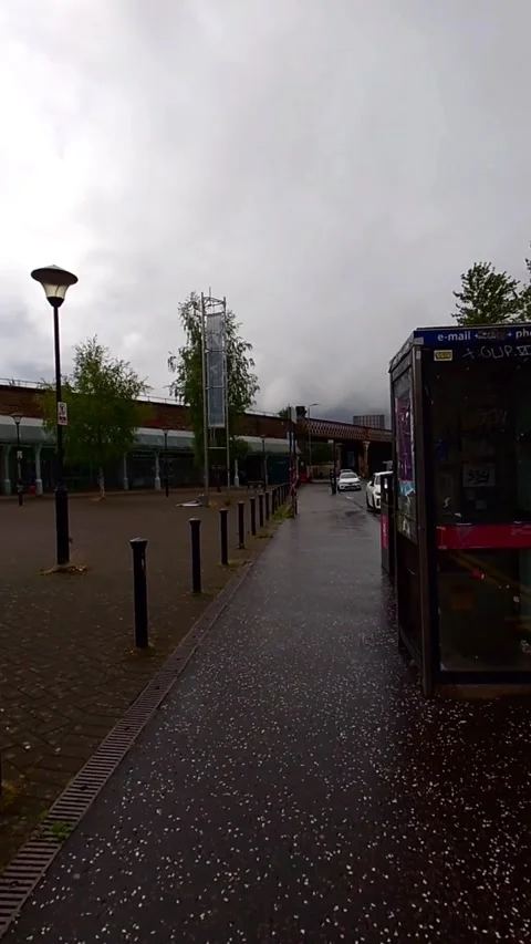Moving towards an old phone booth - Vertical Video Video stock 200401593