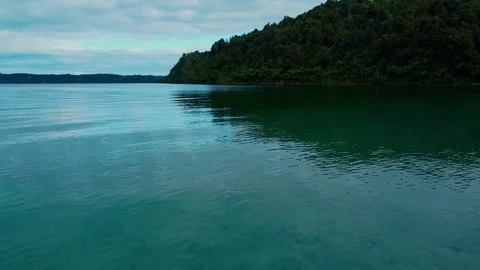 MOVING TOWARDS POINT ON LAKE Stock Footage 230994811
