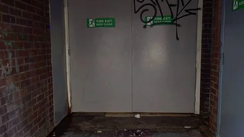 Moving towards a set of fire doors Stock Footage 200262319