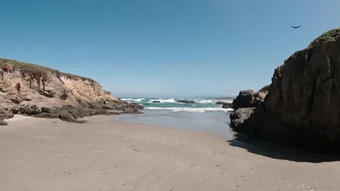 Moving towards the water on a small empty beach in california Stock-Footage 311150300
