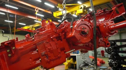 Moving the tractor engine around the shop on the crane beam, the engine is locat Stock Footage 148051410
