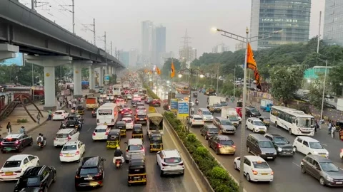 Moving traffic jam at rush hour on a busy main road in Mumbai (Real Time Video). Stock Footage 256642579