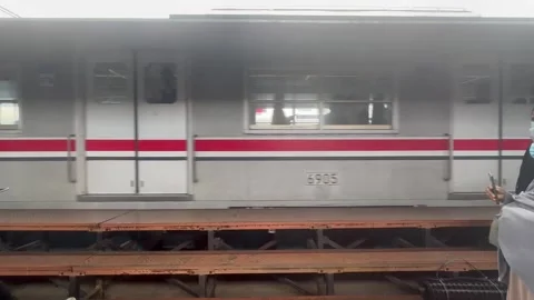 A moving train that about to stop at jakarta Stock Footage 260885348