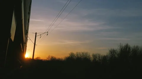 Moving train on background of sunset sky forest Stock Footage 62524744