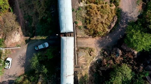 Moving train on a bridge shot from above with cars Stock Footage 156655843