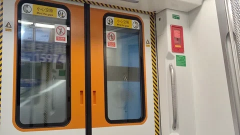 Moving Train Door with People Walking in Shenzhen China Stock Footage 317840847