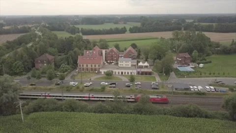 Moving train in front of a building Stock Footage 133042751