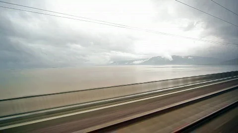 Moving train passes over lake Video stock 856174