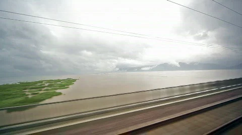 Moving train passes over lake Video stock 856382