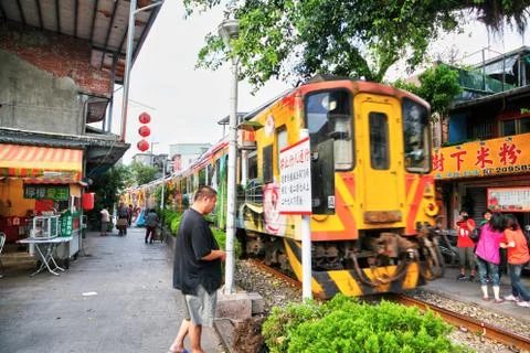 Moving Train Passes Through Heart of Shifen Old Street Stock Photos
