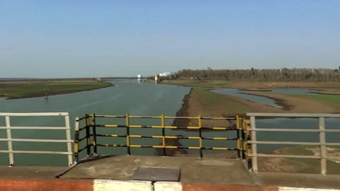 Moving train pov, crossing a bridge over Godavari River, India Stock Footage 140422039