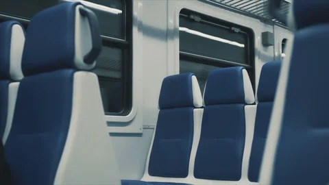 Moving train railway from inside, new blue modern train empty Stock Footage 122588223